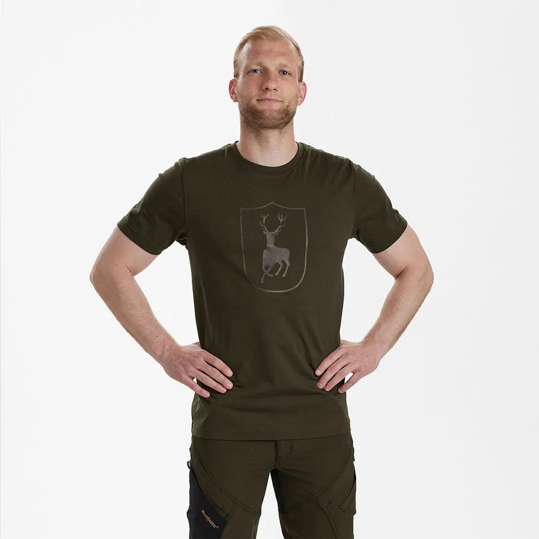 Man in green t-shirt with Deerhunter logo, perfect for country clothing and hunting