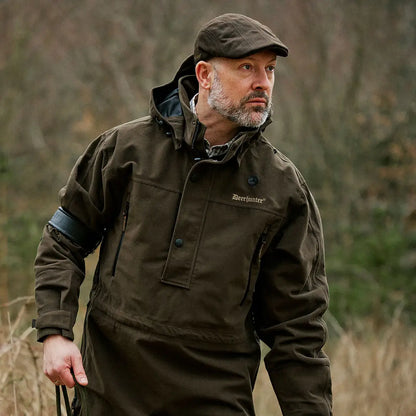 Olive green hunting jacket paired with Deerhunter Pro Gamekeeper Flatcap for stylish country clothing
