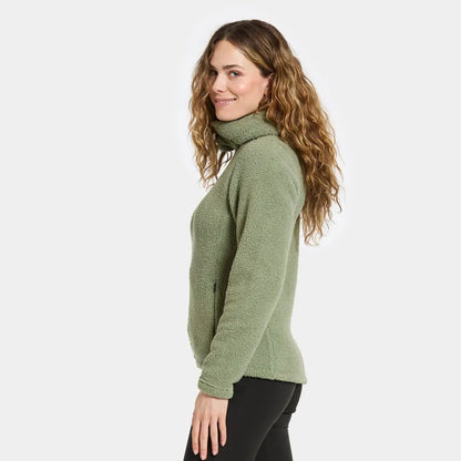 Woman in a green fleece turtleneck, perfect for outdoors and hunting adventures