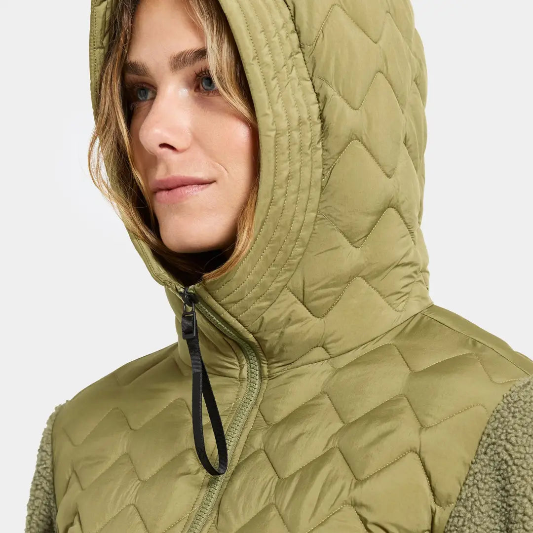 Woman in Didriksons Bibi 2 olive green quilted jacket for country clothing outdoors