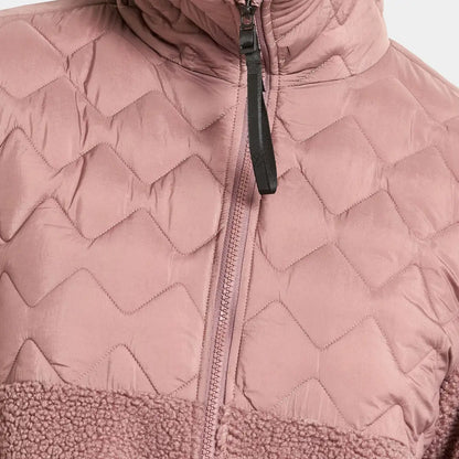 Rose-colored quilted jacket with zip, fuzzy bottom, perfect for country clothing outdoors