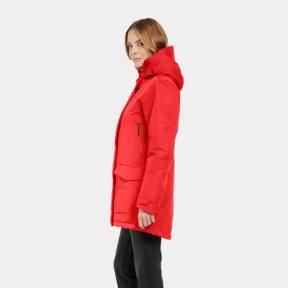 Woman wearing long red sporty mid-length parka Didriksons Frida Womens Parka in winter