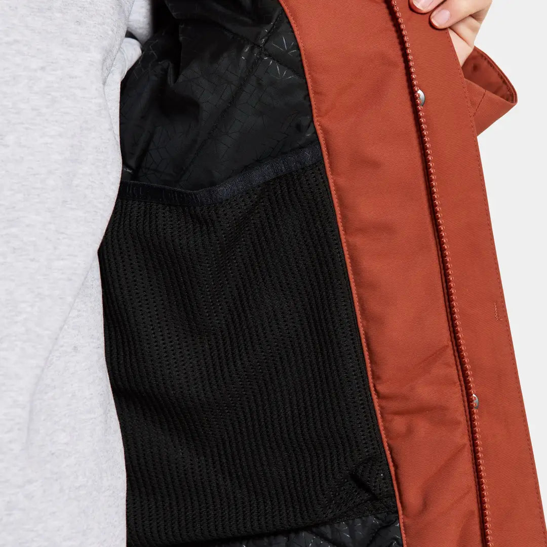 Open rust-colored Didriksons Frida Womens Parka showing sporty mid-length parka design and black mesh pocket