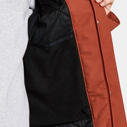 Open rust-colored Didriksons Frida Womens Parka showing sporty mid-length parka design and black mesh pocket
