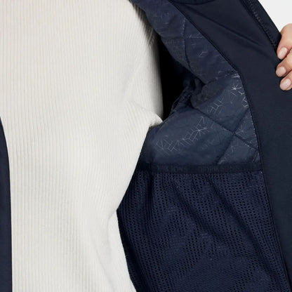 Navy blue sporty mid-length parka with quilted design, mesh lining, and white ribbed top