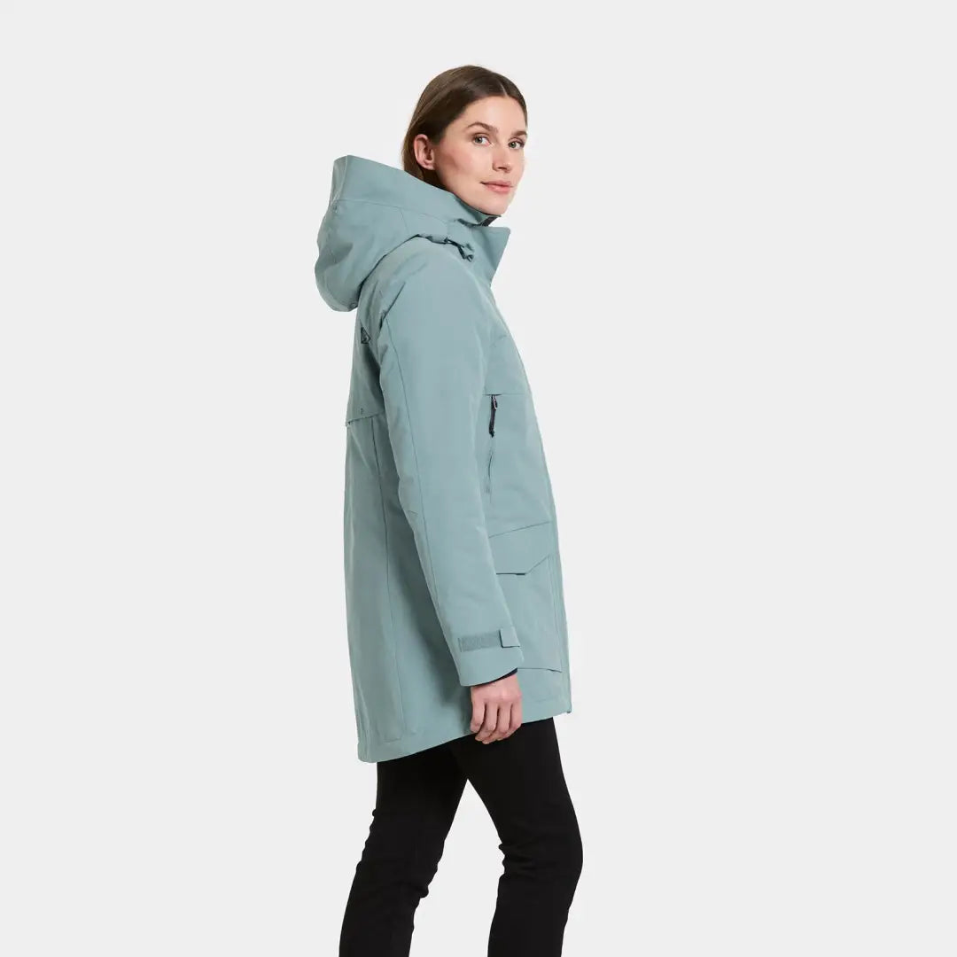 Woman wearing a light blue sporty mid-length winter parka in Didriksons Frida Womens Parka 7