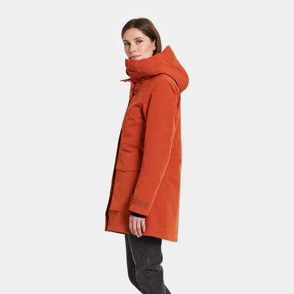 Woman modeling Didriksons Harriet waterproof parka with hood and large pockets for country clothing or hunting