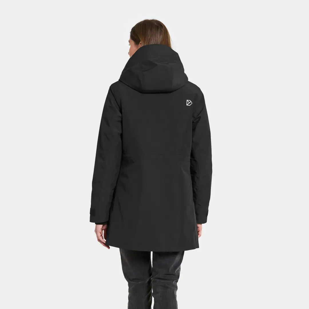Woman modeling Didriksons Harriet black winter coat with hood, perfect for country clothing and hunting