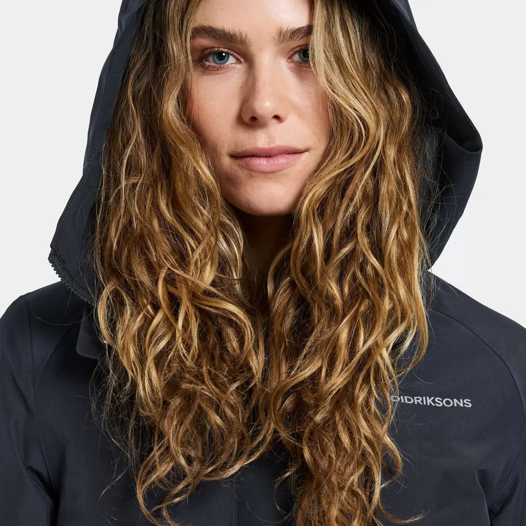 Woman with long wavy blonde hair in Didriksons Harriet Womens Parka for country clothing and hunting