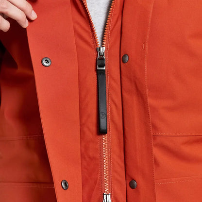 Didriksons Harriet orange rain jacket with leather zipper pull for country clothing and hunting