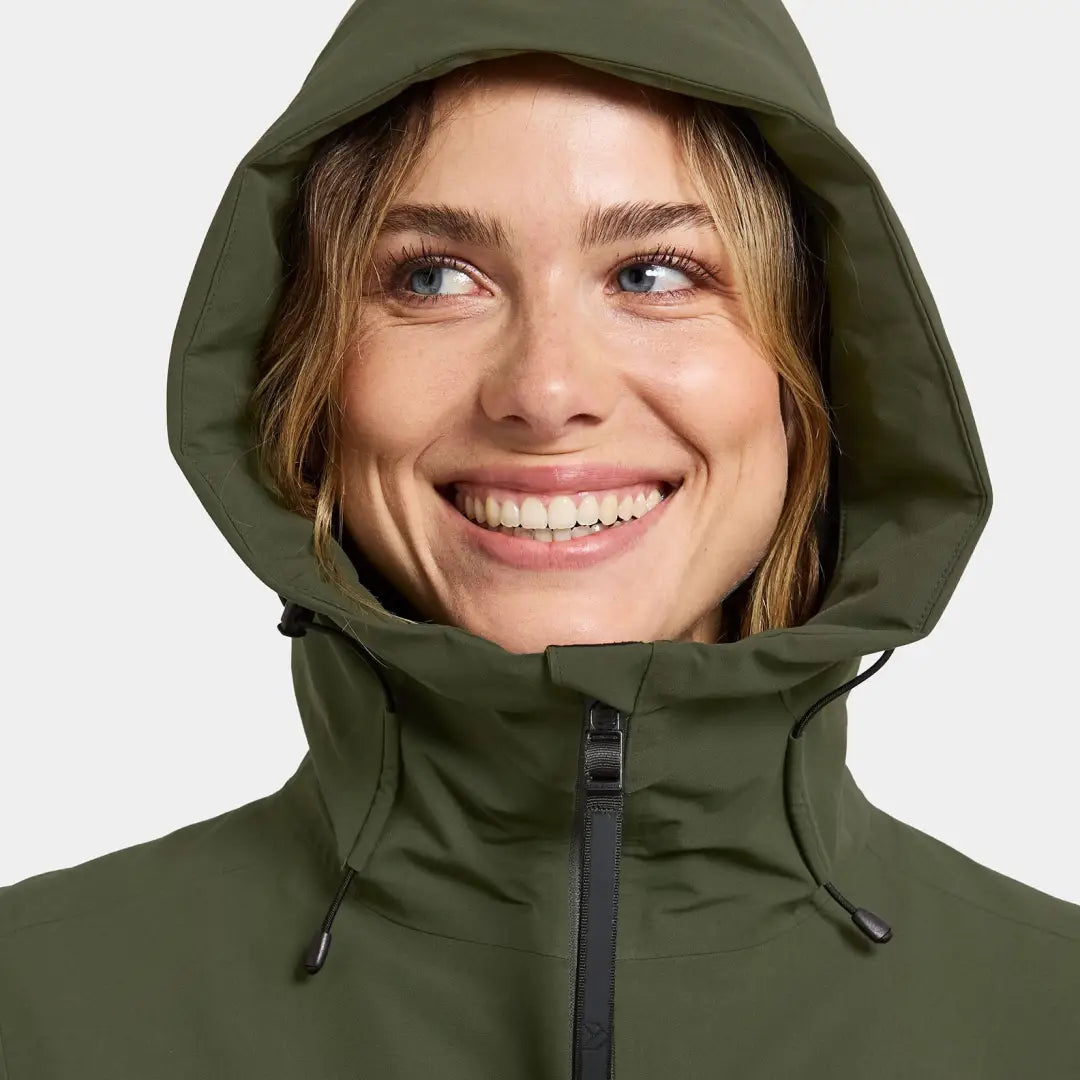 Woman in olive green Didriksons Helle Womens Parka, perfect for country clothing outdoors