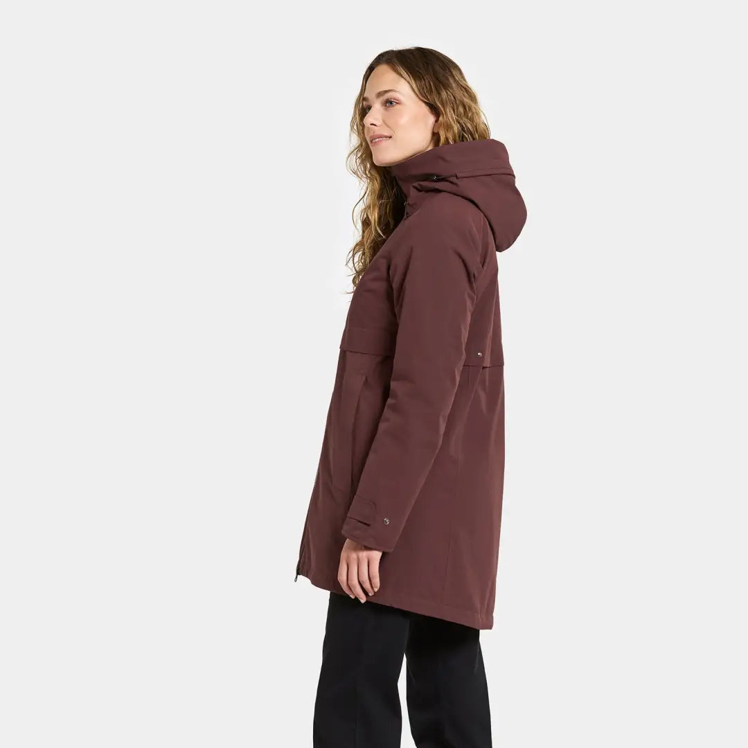Woman wearing Didriksons Helle Womens Parka in maroon, perfect for outdoors country clothing