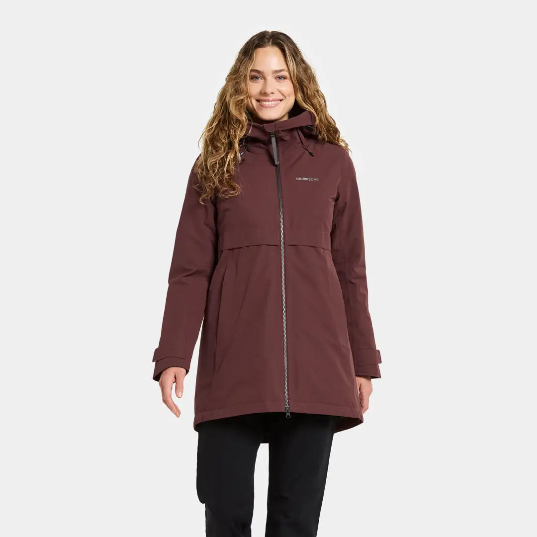 Smiling woman in Didriksons Helle Womens Parka, perfect for country clothing outdoors