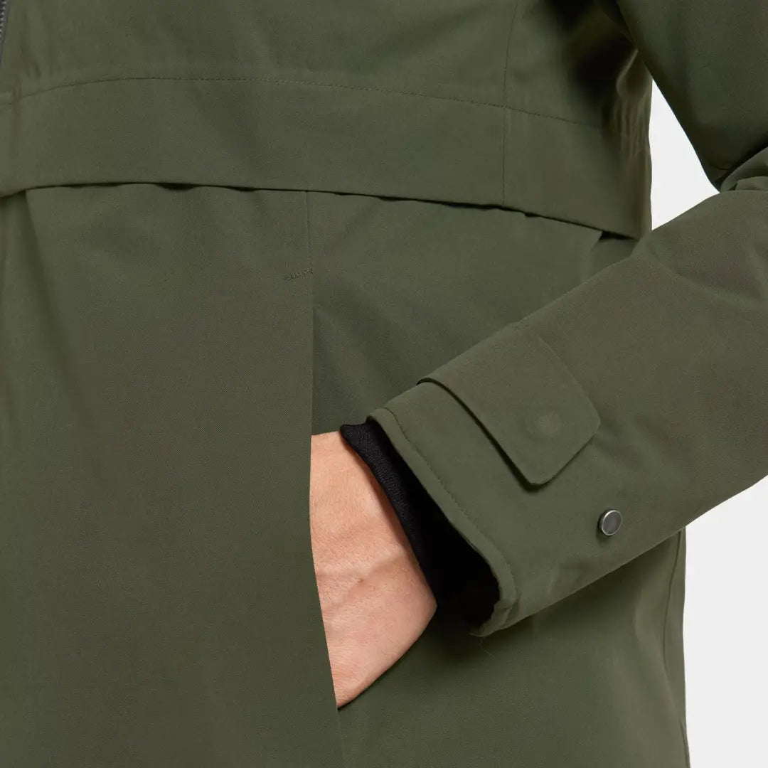 Person’s hand in dark green Didriksons Helle Womens Parka pocket for country clothing outdoors