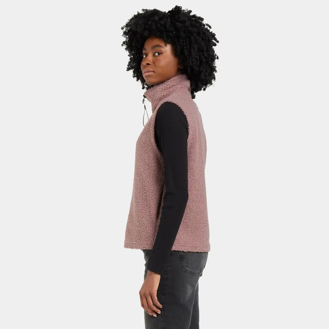 Woman in a mauve fleece vest, perfect for country clothing and outdoor adventures