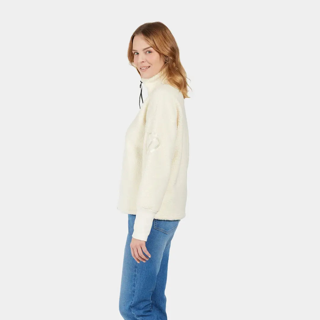 Cream-colored fleece pullover with black drawstring collar, perfect for chilly autumn winds