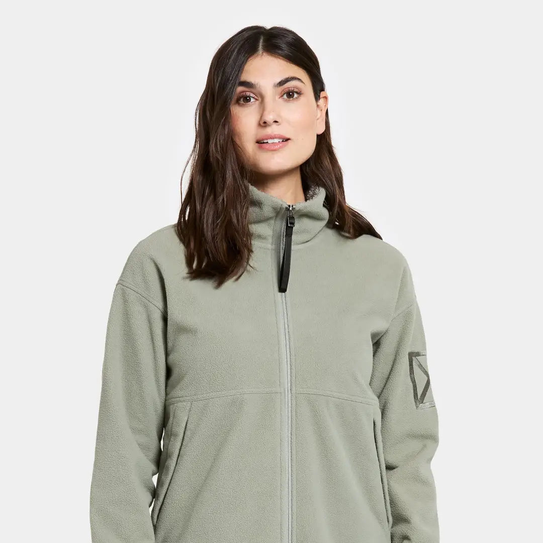 Woman in light green Didriksons Ronja fleece jacket perfect for outdoor country clothing and hunting