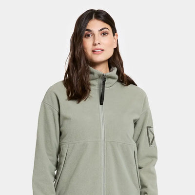 Woman in light green Didriksons Ronja fleece jacket perfect for outdoor country clothing and hunting