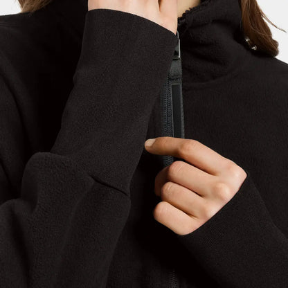 Person zipping up Didriksons Ronja Womens Full Zip Fleece for outdoor country clothing or hunting
