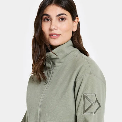 Woman in light green Didriksons Ronja fleece jacket for country clothing and outdoor adventures