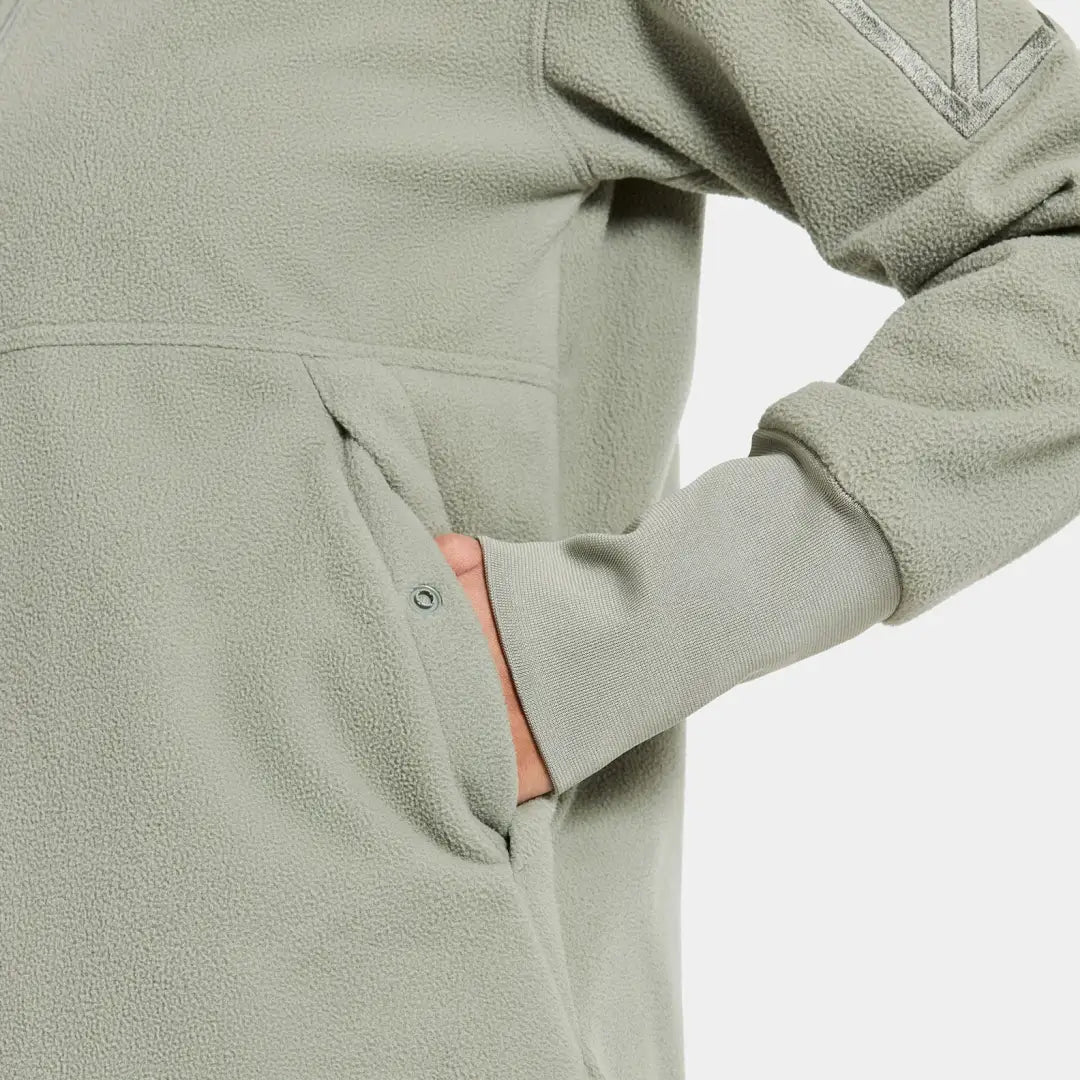 Person in light green Didriksons Ronja fleece jacket perfect for country clothing outdoors