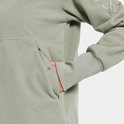 Person in light green Didriksons Ronja fleece jacket perfect for country clothing outdoors