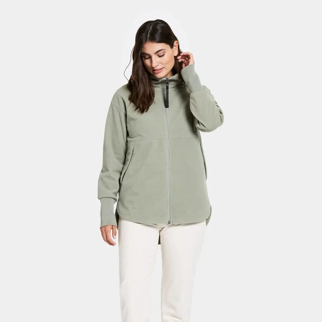 Woman in sage green Didriksons Ronja fleece jacket, perfect for country clothing outdoors