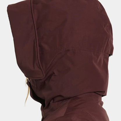 Person in dark red hooded jacket from Didriksons Selina Womens Parka, perfect for country clothing outdoors