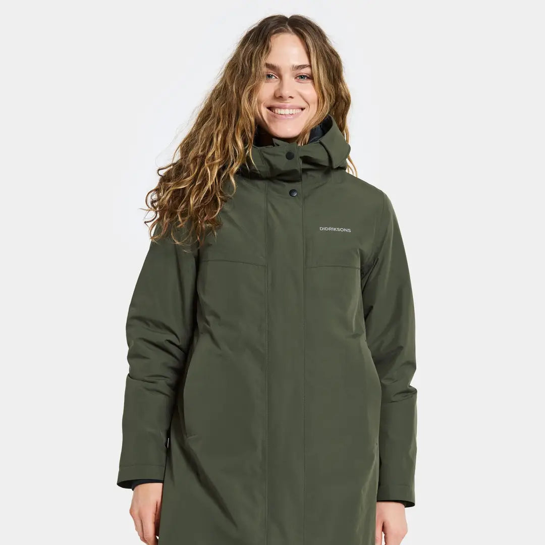 Smiling woman in Didriksons Selina Womens Parka, perfect for country clothing and outdoors