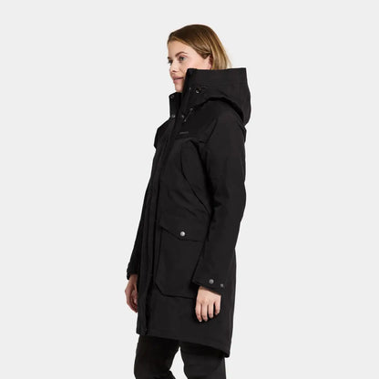 Black hooded winter coat worn by a woman showcasing iconic Didriksons style and warmth