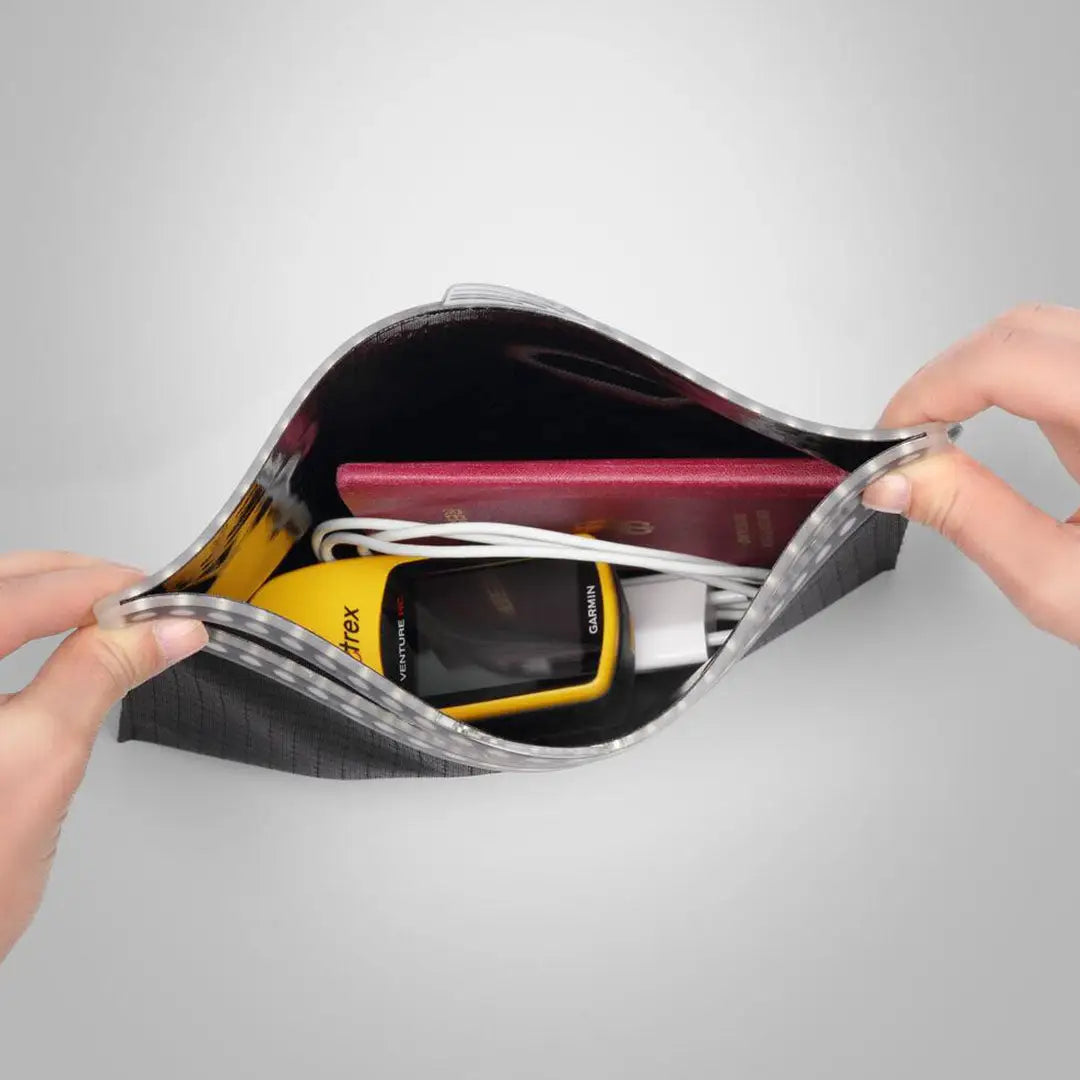 Open gray Fidlock Multi Dry Bag showing contents for ultimate dry storage
