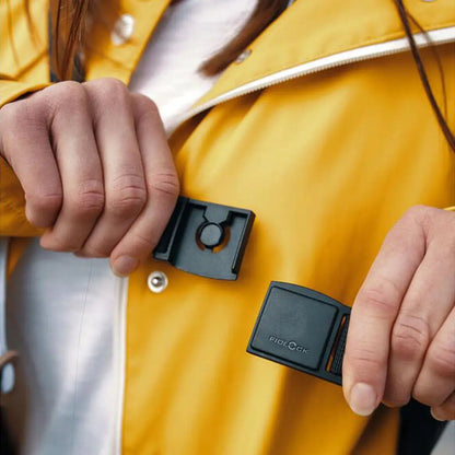 Yellow jacket with magnetic closure on Fidlock Sling Bag Dry Bag for outdoor adventures