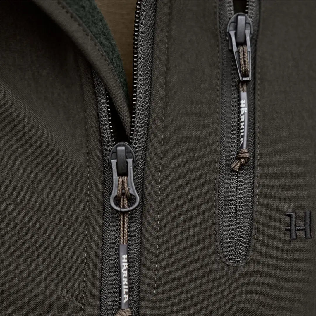 Dark green Härkila Fjell Fleece Jacket with zippers perfect for outdoor adventures