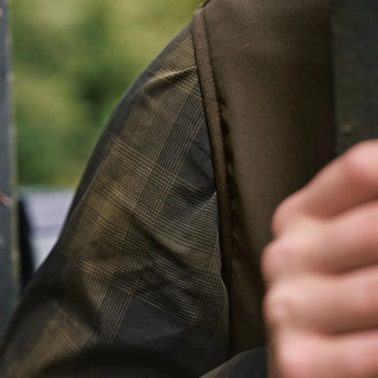 Plaid olive jacket sleeve of Härkila Fjell Fleece Waistcoat for outdoor gear