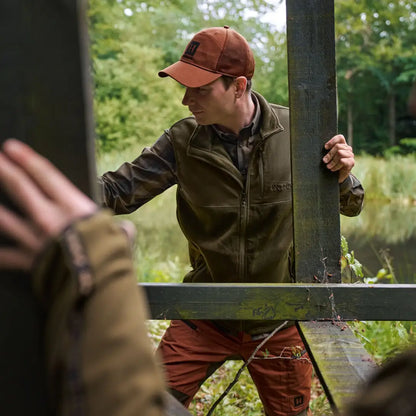 Man in hunting attire wearing Härkila Fjell Fleece Waistcoat outdoors