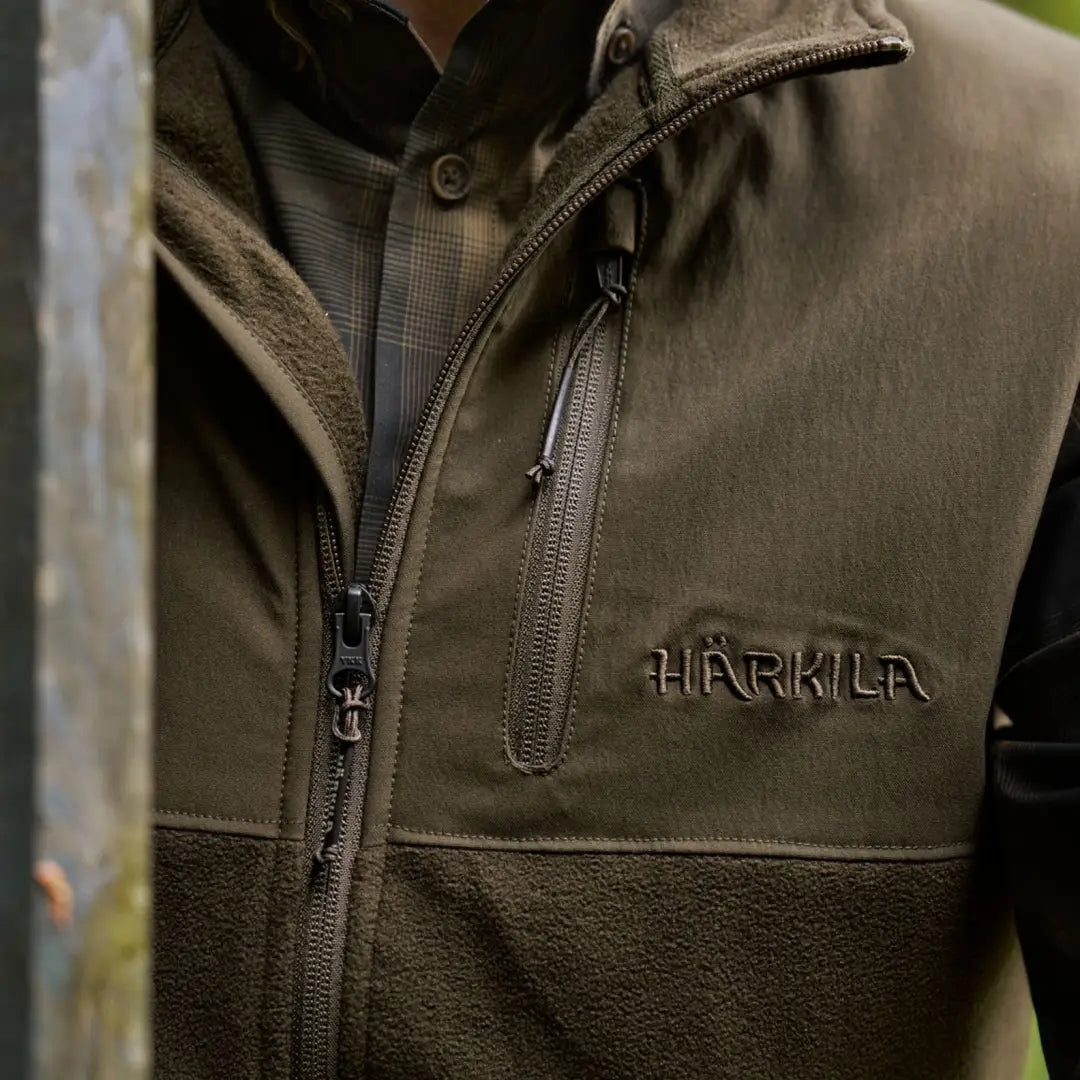 Olive green Härkila Fjell Fleece Waistcoat perfect for outdoor adventures