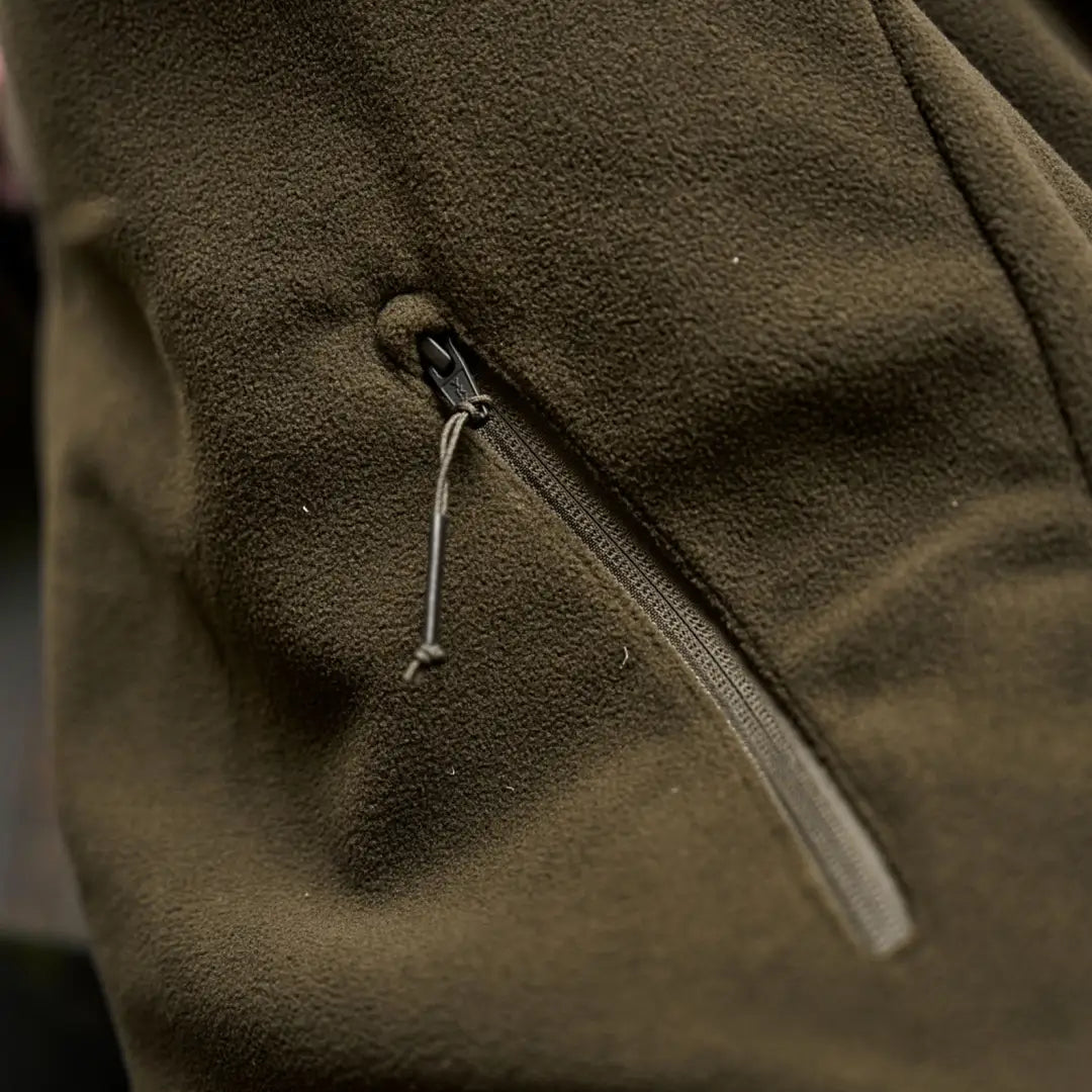 Olive green Härkila Fjell Fleece Waistcoat with zippered pocket for outdoor adventures