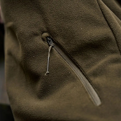 Olive green Härkila Fjell Fleece Waistcoat with zippered pocket for outdoor adventures