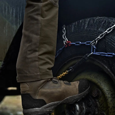Brown leather work boot paired with Härkila Hill Trousers for hunting and country clothing