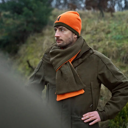 Man in outdoor country clothing wearing Härkila Reversible Beanie for hunting trips