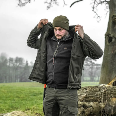 Man in olive green outfit wearing Harehill Beanie to stay warm for outdoor enthusiasts