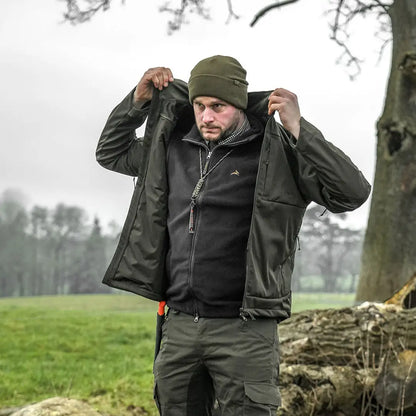 Man in olive green outfit wearing Harehill Beanie to stay warm for outdoor enthusiasts