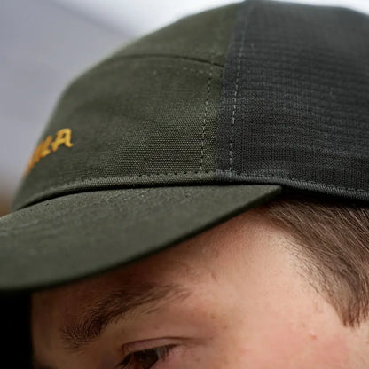 Olive green Harkila Impact Cap, perfect for country clothing and hunting adventures