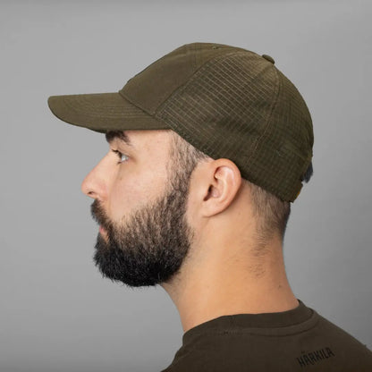 Olive green Harkila Instinct Cap, perfect for country clothing and hunting adventures