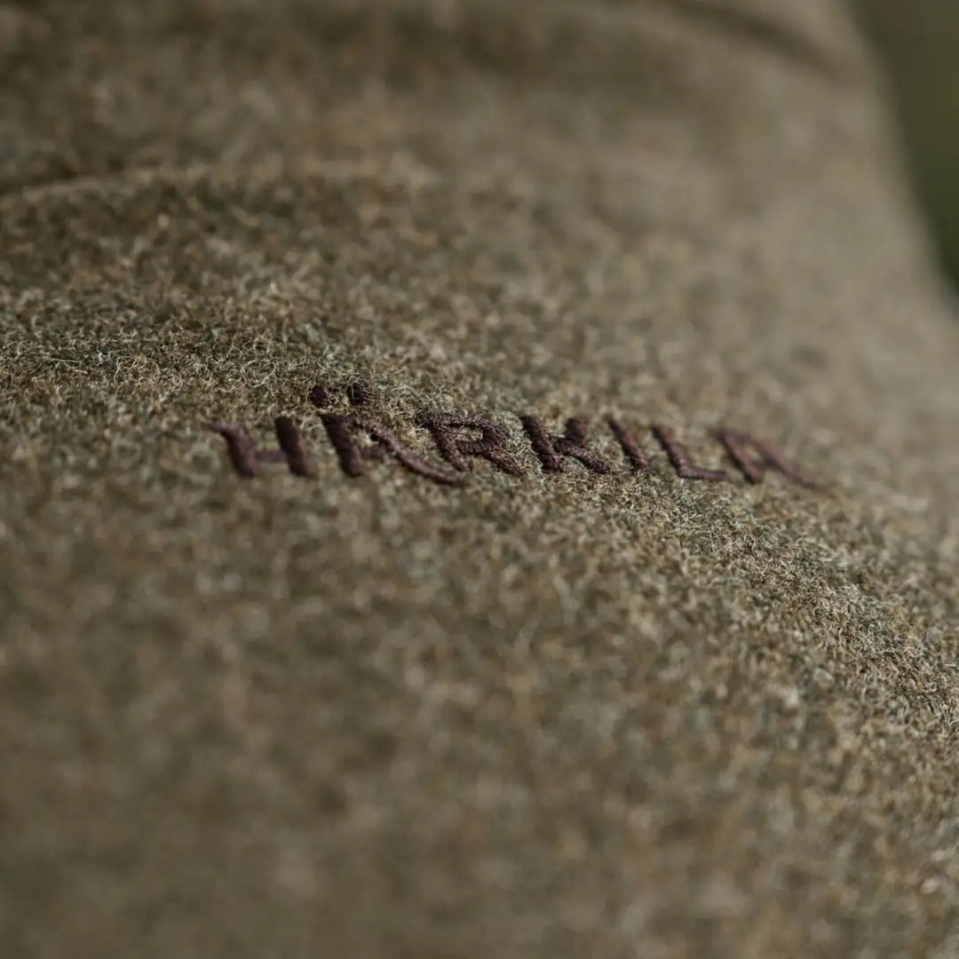 Olive green wool fabric with embroidered logo on Harkila Kenmore GTX Jacket, gtx jacket