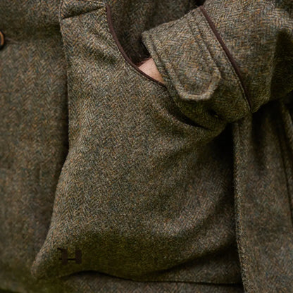 Herringbone tweed jacket with hand in pocket, part of Harkila Kenmore Shooting Waistcoat collection