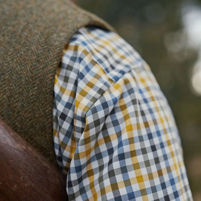 Plaid shirt sleeve and tweed vest showcasing Harkila Kenmore Waistcoat style