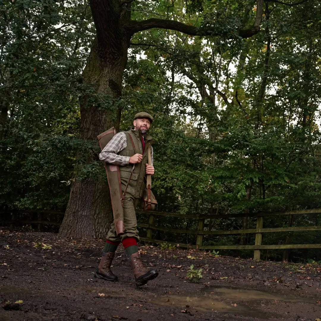 Hunter with gear wearing Harkila Kenmore Waistcoat for outdoor adventures