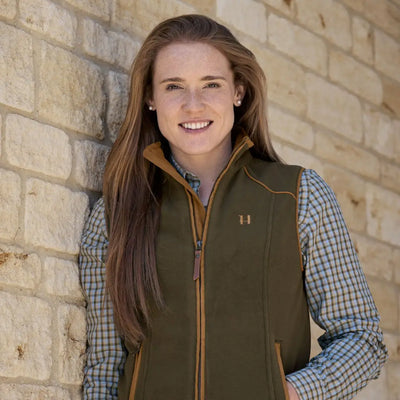 Stylish woman in Harkila Sandhem 200 Waistcoat, boasting wind-resistant check lining