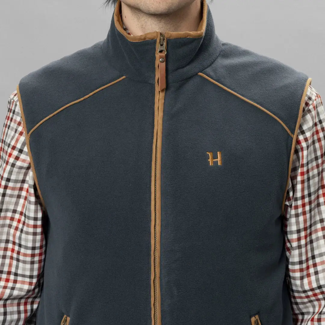 Dark gray Harkila Sandhem Waistcoat with tan trim, perfect for country clothing and hunting